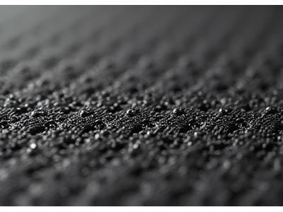 Black skateboard grip tape with coarse texture